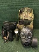 An Army bag containing gas mask and torch,