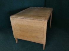 A mid 20th century oak drop end table