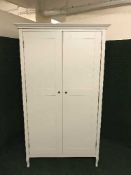 A cream double door wardrobe