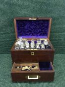 A Victorian mahogany chemist's box fitted with bottles and scales