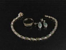 A 9ct gold emerald and diamond bracelet together with pair of earrings and matching dress ring.