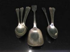 A bag of eight silver spoons together with a heavy brass star picture frame commemorating the