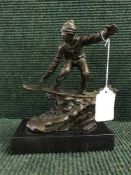 A bronze figure on stone base : Snowboarder, height 22 cm.