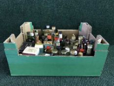 A large collection of alcohol miniatures including McGibbon's Scotch Whisky in ceramic golf club
