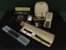 A tray of boxed Dunhill lighter, wrist watches, pens,