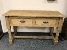 A reclaimed pine side table fitted with two drawers