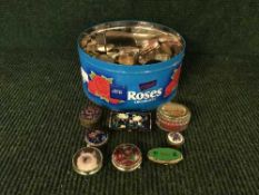 A tin of assorted pill boxes