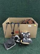 A box of cameras and equipment including cameras by Kodak, Pentax,