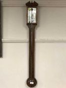 An inlaid mahogany stick barometer, the silvered dial signed Comilli, Holborn.