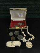 A carved bracelet and bracelet together with assorted coins - pennies, six pence pieces,