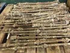 A pallet of wrought iron fence spindles