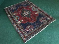 A Persian Hamadan woolen rug