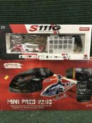 An Art tec mini Predv 2.VG remote controlled helicopter together with one other.