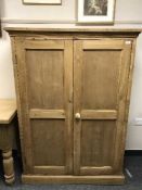 A reclaimed pine two door kitchen cupboard