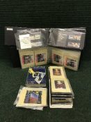 Three albums of first day covers and stamp postcards