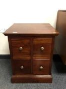 A contemporary four drawer low chest