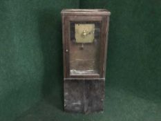 A late nineteenth century oak cased wall clock