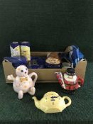 Two boxes of Tetley tea folk items, tins,