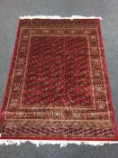 A Persian Bokhara designed rug with silk pile 190 cm x 140 cm