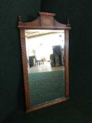 An inlaid yew wood wall mirror