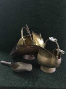 A copper log basket together with three brass coal buckets