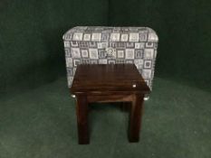 A hardwood lamp table and a storage ottoman