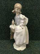 A Lladro figure - Girl Holding lamb