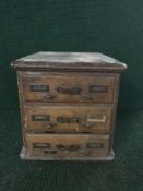 A Victorian oak three drawer desk topped chest