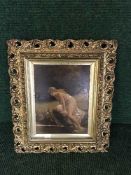 A gilt framed panel depicting a lady by a river,