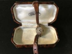 A lady's 9ct gold watch on leather strap