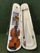 A contemporary violin and bow in case