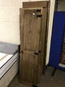 A dismantled pine triple door wardrobe