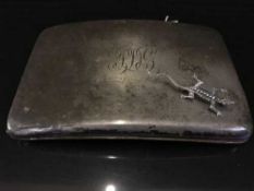 A silver cigarette case, 6.