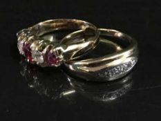 An 18ct gold ruby set ring together with a three stone diamond ring.
