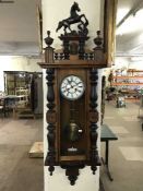 A mahogany cased Vienna wall clock