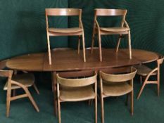 A mid twentieth century teak extending drop leaf dining oval,