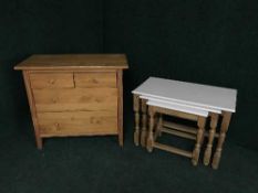 A nest of tables and a pine four drawer chest