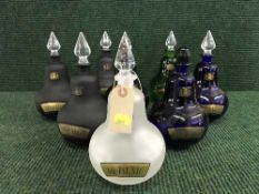 A tray eight assorted glass chemist's decanters with stoppers