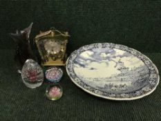 A tray of large delft charger, three glass paperweights, glass vase,
