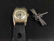 A lady's Dixon Philip wrist watch and a silver dragonfly brooch