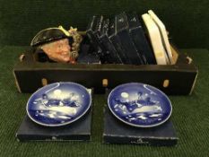 A basket of Royal Copenhagen plates,