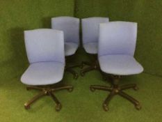 A set of four Comforto swivel office chairs (blue)