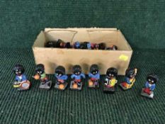 A box of Robertson's golly band players and footballers