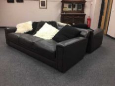 A pair of high quality brown leather three seater settees together with scatter cushions.