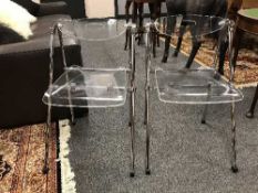 A pair of contemporary perspex and chrome folding chairs (2)
