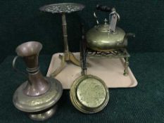 A tray of two brass trivets, copper and brass jug,