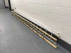 An aluminium extension ladder together with a roof ladder