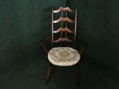 An Ercol high backed armchair