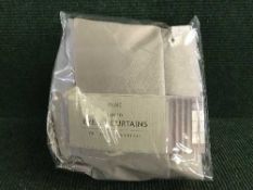 A box of Next curtains and curtain rails