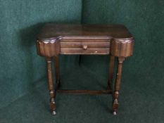 An oak hall table fitted a drawer
